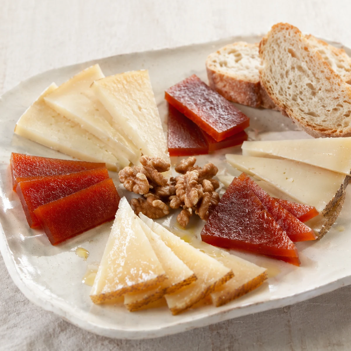 Best Wine Pairing for Manchego and Idiazábal Cheese Platter with Quince Paste and Walnuts